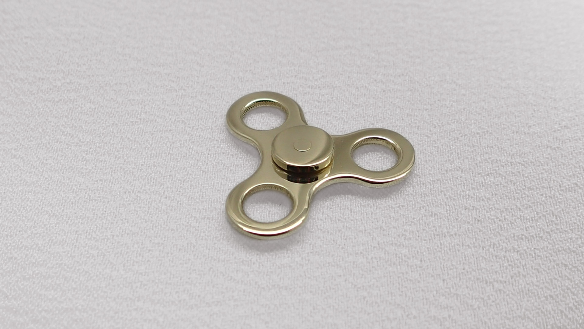 Zlatý přívěsek fidget spinner